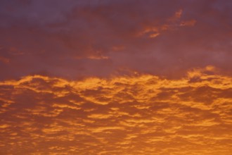 Dramatic sky with orange-red clouds at sunrise, Großheubach, Miltenberg, Main, Spessart, Bavaria,