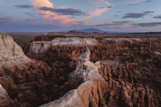 Stunning aerial photograph capturing Goblin Valley State Park, Utah, at sunset with its unique rock