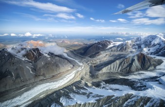 Glacier bed and colored mountains, aerial view, Alaska Range, Denali National Park, Alaska, USA