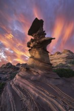 Stunning sunset with fiery skies illuminating the unique rock formations of Coyote Buttes in the