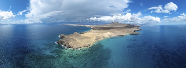 Headland and blue sea, coastal landscape, arid landscape of Los Ajaches Natural Park, aerial view,