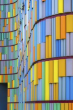 A striking image depicting the vivid, multicolored facade of a contemporary building, showcasing a