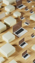 Multiple laptops rest on a geometric background made of tiles, showcasing a modern and abstract