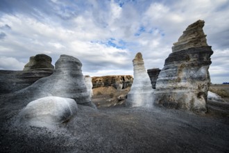 Eroded rock formations, volcanic landscape with dramatic cloudy skies, Ciudad Estratificada or Los
