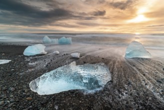 Captivating view of Diamond Beach in Iceland, showcasing stunning ice chunks scattered on the black