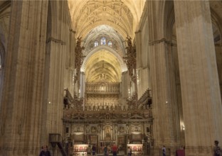 Impressive organ and architecture with ornate vaults in a church, Seville, Andalusia, Spain