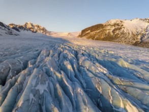 The stunning beauty of the Skaftafell Glacier during winter. The sunlight accentuates the rugged