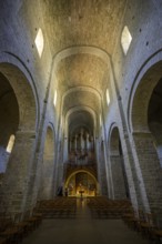View of the entrance and the organ in the abbey of Gellone, also Saint-Guilhem-le-Désert monastery,