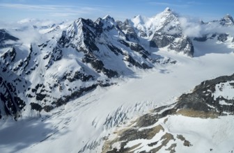 Snow and ice, epic mountains with glaciers, aerial view, Alaska Range, Denali National Park,