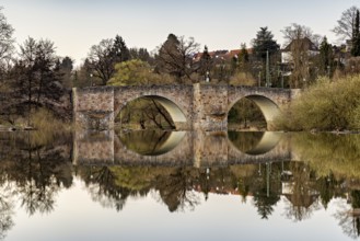 Stone bridge reflected in the calm water with surrounding nature, The historic Bartenwetz stone