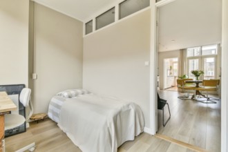 A serene living space showcasing a minimalist design with soft lighting, wooden floors, and a