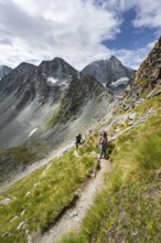 Mountaineer on a hiking trail, mountain landscape, ascent to Col de Riedmatten, behind summit Mont
