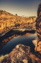 Bell Gorge waterfall, a body of water in north-west Australia in the Kimberley. Sunrise in the