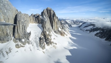 Cliffs, Kichatna Spires, snow and ice, epic mountains with glaciers, aerial view, Alaska Range,