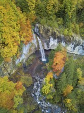 Aerial view of Berglistüber waterfall in autumn-colored surroundings, Linthal, Klausenpass, Canton