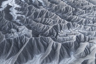 Captivating aerial shot capturing the intricate and rugged landscape of Caineville Mesa, near