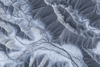 Aerial photograph showcasing the intricate textures and patterns of the eroded terrain near