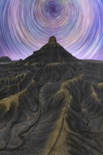 Stunning night view of the Milky way over Utah sandstone desert, showcasing star trails in a clear