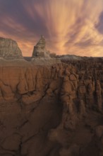 A stunning view of unique sandstone formations under a dramatic sky in Goblin Valley State Park,
