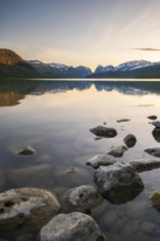Mountains of the Kebnekaise massif reflected in Lake Ladtjojaure, Nikkaluokta, Lapland, Sweden