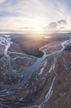 Breathtaking aerial view of meandering rivers in Iceland's Highlands, capturing the dramatic
