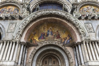 Entrance portal with mosaic of the Basilica di San Marco, built in the 11th century, Venice,
