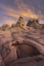 Dramatic sunset illuminates the unique rock formations at Coyote Buttes in the Paria
