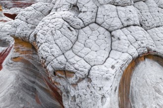 This image captures a unique natural landscape of white rocks, characterized by deep, intricate