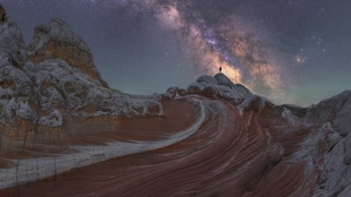 A stunning nightscape of the Milky Way galaxy arching over the unique rock formations at White