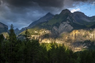 Majestic mountain landscape at Oachinensee, Switzerland, showcasing dramatic clouds and sunlight