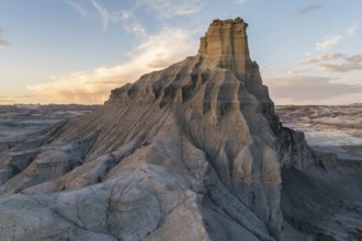 A breathtaking landscape of towering rock formations captured at sunset, showcasing the serene