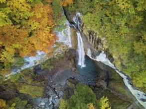 Aerial view of Berglistüber waterfall in autumn-colored surroundings, Linthal, Klausenpass, Canton
