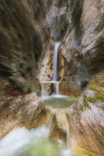 Waterfall with zoom effect Heckenbach waterfall, The dripping eye of nature, Kochel am See,
