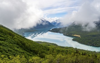 View of snowy mountains in spring and turquoise blue Kenai Lake, Slaughter Ridge Trail, Cooper