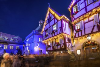 Colourfully illuminated and Christmassy decorated half-timbered houses, old town, blue hour,