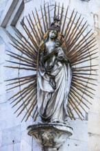 Mary with the Infant Jesus on the façade of the church of San Michele in Foro, historic city