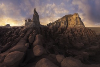 Stunning sandstone formations illuminated by soft sunlight in Goblin Valley State Park, Utah. The