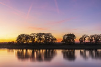 Colourful evening sky after sunset on the Elbe in Kreinitz, Saxony, Germany