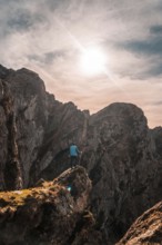 A hiker at the top of the mountain of Aiako Harria or Peñas de Aya in the town of Oiartzun,