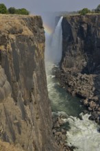 Rainbow over Victoria Falls on the Zambezi River, UNESCO World Heritage Site since 1989, Victoria