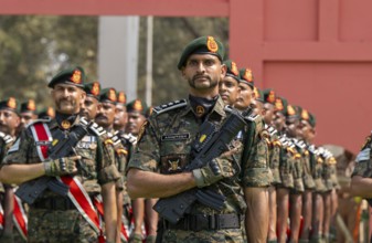 Central Reserve Police Force (CRPF) personnel wearing ceremonial headgear stand in formation during