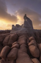 Stunning sandstone formations in Goblin Valley State Park, Utah, under a dramatic sky. The unique