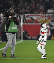 During the DFL and VfB Stuttgart Innovation Matchday, an AI-supported robot hands over the Adidas