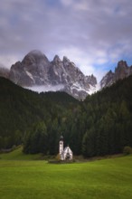 View of the church of St. Johann in Ranui with the Geißler group in the background, Dolomites,
