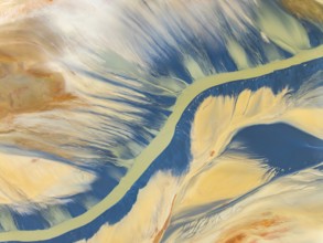 From above, this striking aerial shot captures vibrant natural textures and a sinuous river amidst
