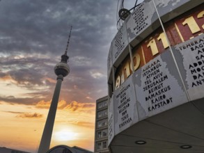 Dramatic sunset with the Berlin TV Tower and the Berlin World Clock in the foreground,