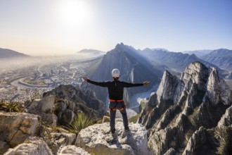 Man embraces breathtaking views while practicing mountaineering and rappelling in Eagleâ€™s Nest,