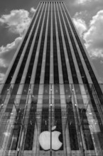 Apple logo in front of a skyscraper in Central Park, New York City, USA