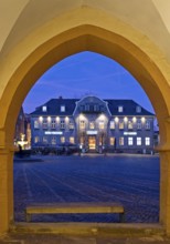 View from the open hall of the late Gothic town hall in Goslar in the evening onto the market