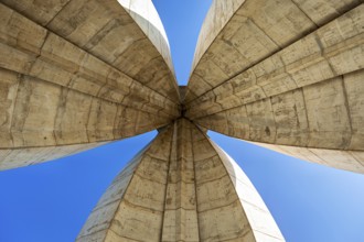 Symmetrical view of the concrete arches of a modern monument, The National Independence Monument in